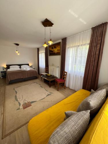 a bedroom with a bed and a living room at Aparts4ring 10, Nürburg in Nürburg