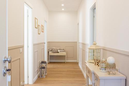 a hallway with a desk and a bed in a room at Dolce Conero Guest House in Camerano