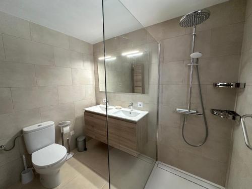 a bathroom with a shower and a toilet and a sink at ArteVida Andalusia FKK Nudist Holiday with yoga and massage in Mojácar