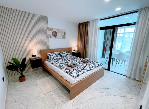 a bedroom with a bed and a large window at Terrazas 532 in San Miguel de Abona