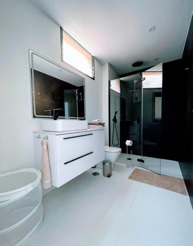 a white bathroom with a sink and a toilet at Terrazas 532 in San Miguel de Abona