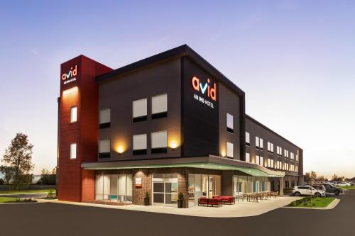 a rendering of a building with cars parked at avid hotels - Memphis - Southaven by IHG in Southaven