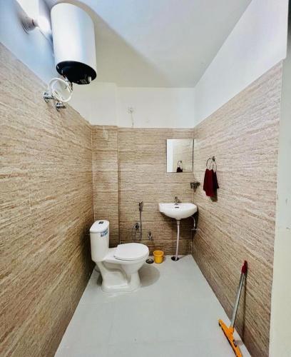 a bathroom with a toilet and a sink at Hostel ivory in Jaipur
