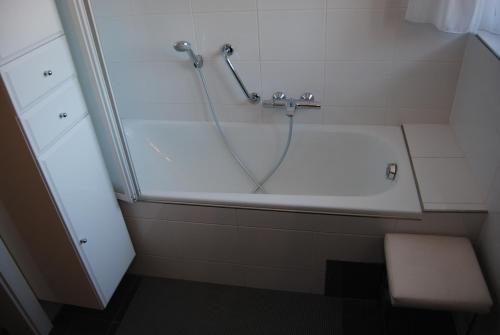 a bathroom with a bath tub with a shower at Fewo Ossiach in Ossiach