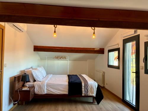 a bedroom with a bed in a room at Casa Vilariça in Alfândega da Fé