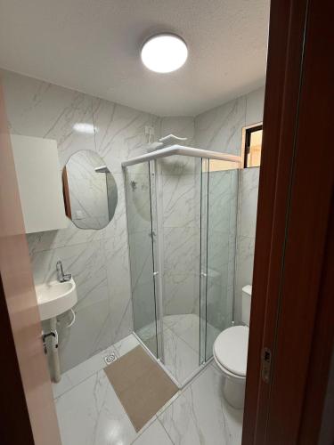 a bathroom with a shower and a toilet at Lisboa in João Pessoa