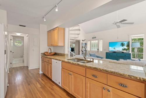a kitchen with a sink and a counter top at Lighthouse Lookout in Sanibel