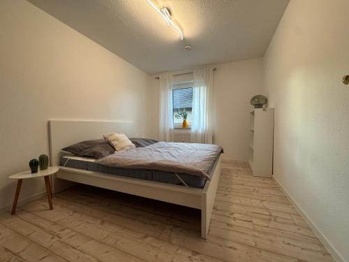 a bedroom with a bed and a window at Sweet Escape in Bad Pyrmont
