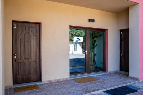 two doors on the side of a house at Case Vacanze Marinella in Viverone