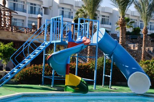 a playground in a pool with a slide at Queen Sharm Aqua Park Hotel in Sharm El Sheikh
