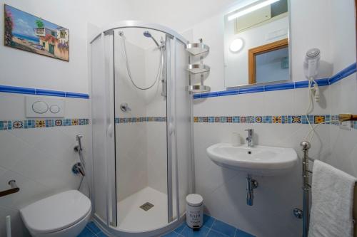 a bathroom with a shower and a toilet and a sink at Casa Alfonso in Minori