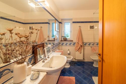 a bathroom with two toilets and a sink at Marli Home in Corropoli