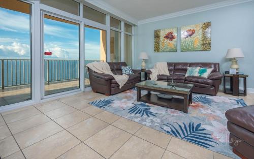 a living room with a couch and a table at Phoenix Gulf Shores 1602 in Gulf Shores