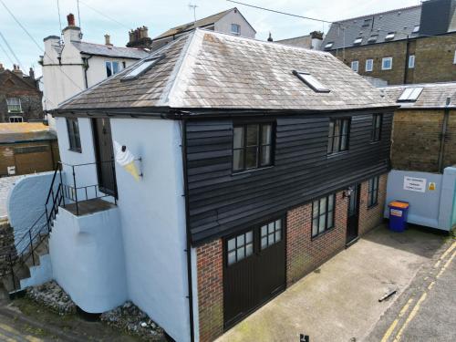 a black and white house with a garage at Old Boathouse 3 Bed 2 Bath Nr Beach Inc Parking in Broadstairs