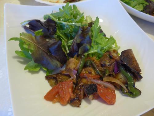 a white plate of food with a salad on it at Maison de Luciné in Combourg
