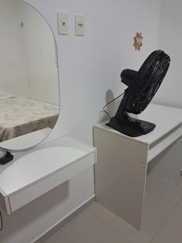 a hair dryer sitting on a counter in a bathroom at Apto com área de lazer estilo resort in Parnamirim