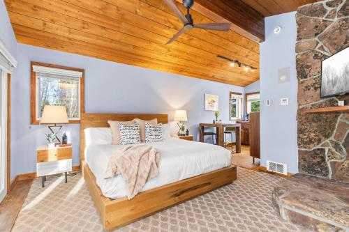 a bedroom with a bed and a wooden ceiling at Abode at Alpine Retreat in Wilson