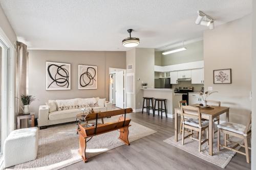 a living room with a couch and a table at Quiet Gated Condo Near Universal with Pool and View in Orlando