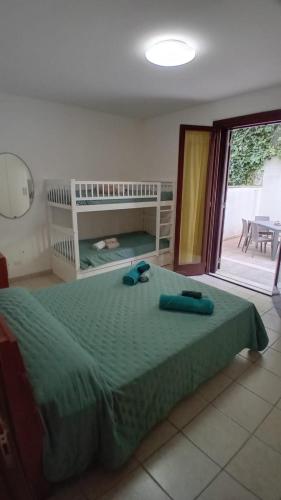 a bedroom with a bed with two towels on it at terrazza acquaviva in Marittima