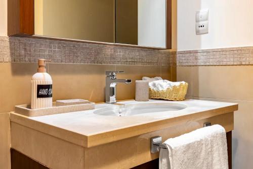 a bathroom counter with a sink and a mirror at Private Room in Luxurious 3BR Apartment with BURJ KHALIFA view in Downtown near Dubai Mall in Dubai