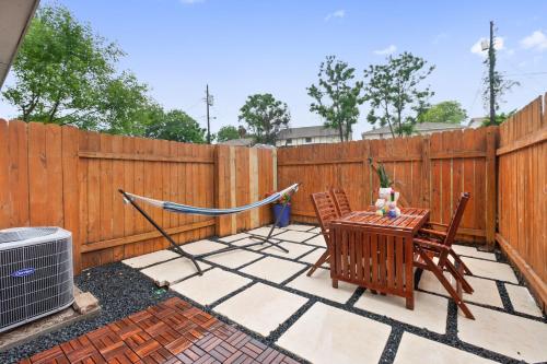 a patio with a hammock and a table and chairs at Contemporary Couples Getaway Near Austin Favorites - Loft 21 in Austin
