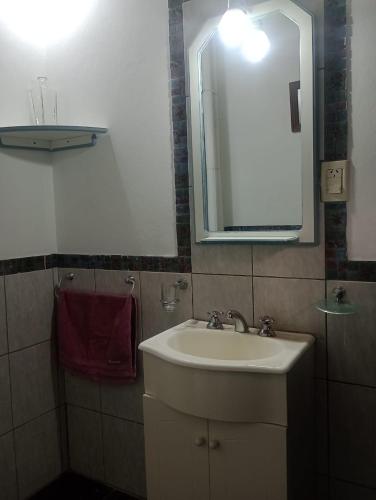 a bathroom with a sink and a mirror at En Santa Rosa in Santa Rosa