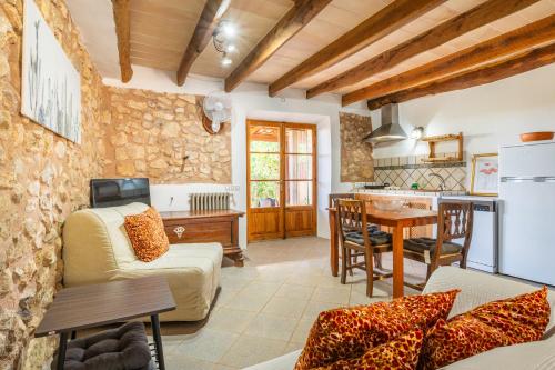 a living room with a couch and a table at Agroturismo Sa Vall by MHR in Son Macia