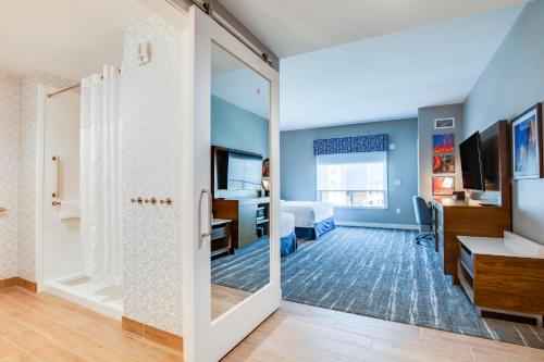 a room with a door leading to a bedroom at Hampton Inn & Suites By Hilton Louisville East Oxmoor in Louisville
