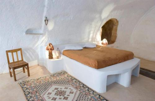 מיטה או מיטות בחדר ב-Au Trait d'Union Tijma Matmata