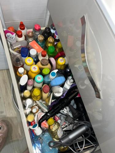 a drawer filled with lots of different types of bottles at Bungalow Ti Paradis in Baie-Mahault