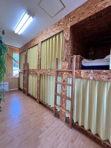 a room with two bunk beds and a ladder at Agri Museum NADA - Vacation STAY 09937v in Minamiawaji