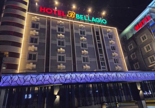 a hotel with a sign on the side of it at 벨라지오호텔 in Sagog-yŏk