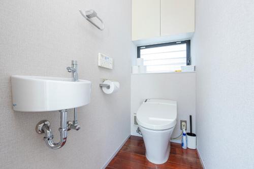 a bathroom with a sink and a toilet at Pufuka Mukojima 1 in Tokyo