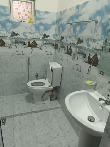 a bathroom with a toilet and a sink at Home stray 7 in Matara