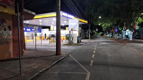 an empty gas station at night with at Pousada Central in Montes Claros