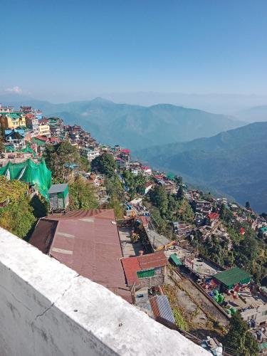 a view of a city from the top of a building at Bluemoon stay in Darjeeling