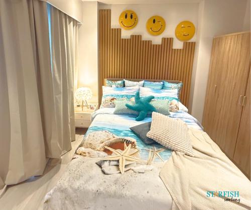 a childs bedroom with a bed with a toy dinosaur on it at Condotel in Tambuli Seaside Studio - F21K in Maribago
