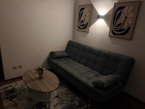 a living room with a couch and a table at Apartment Dolina 8a Kärnten KLagenfurt in Dolina