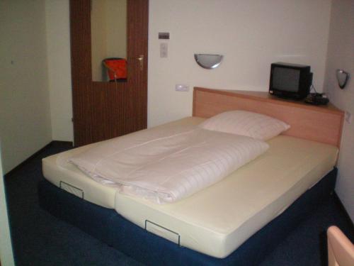 Ένα ή περισσότερα κρεβάτια σε δωμάτιο στο Hotel Rebstock