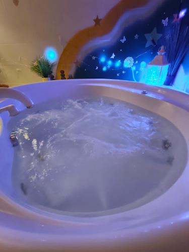 a jacuzzi tub in a room with lights at Pension Relax in Litoměřice
