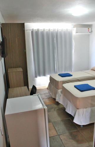 Katil atau katil-katil dalam bilik di Pecém Hotel