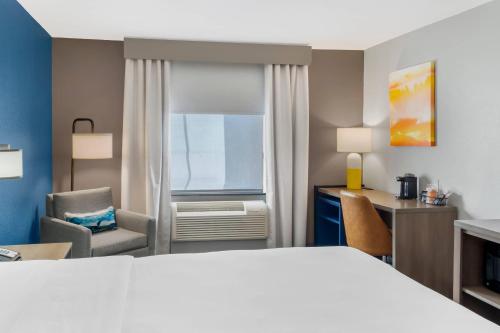 a hotel room with a bed and a desk at Comfort Inn & Suites El Paso I-10 Airport Area in El Paso