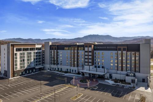 an aerial view of a hotel with mountains in the background at Tempo By Hilton Pigeon Forge in Pigeon Forge