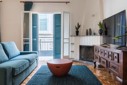a living room with a couch and a coffee table at Bluewood Retreat|Cozy Vintage 3BDR Nicosia Heart in Nicosia