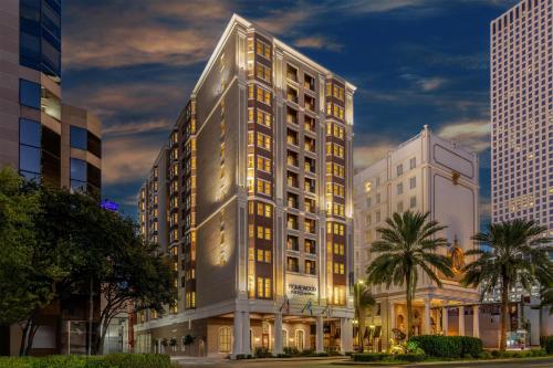 a tall building in a city at night at Homewood Suites by Hilton New Orleans in New Orleans
