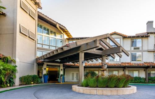 a building with a staircase in front of it at DoubleTree by Hilton Campbell - Pruneyard Plaza in Campbell