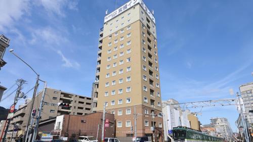 a tall building in the middle of a city at Toyoko Inn Kyoto Biwako Otsu in Otsu