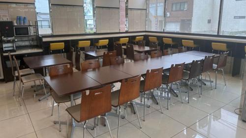 a classroom with rows of tables and chairs at Toyoko Inn Kyoto Biwako Otsu in Otsu