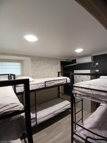 a group of bunk beds in a room at LIBERTY Hostel in Mykolaiv