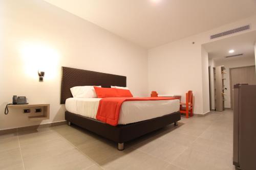 Una cama o camas en una habitación de Hotel Ventura